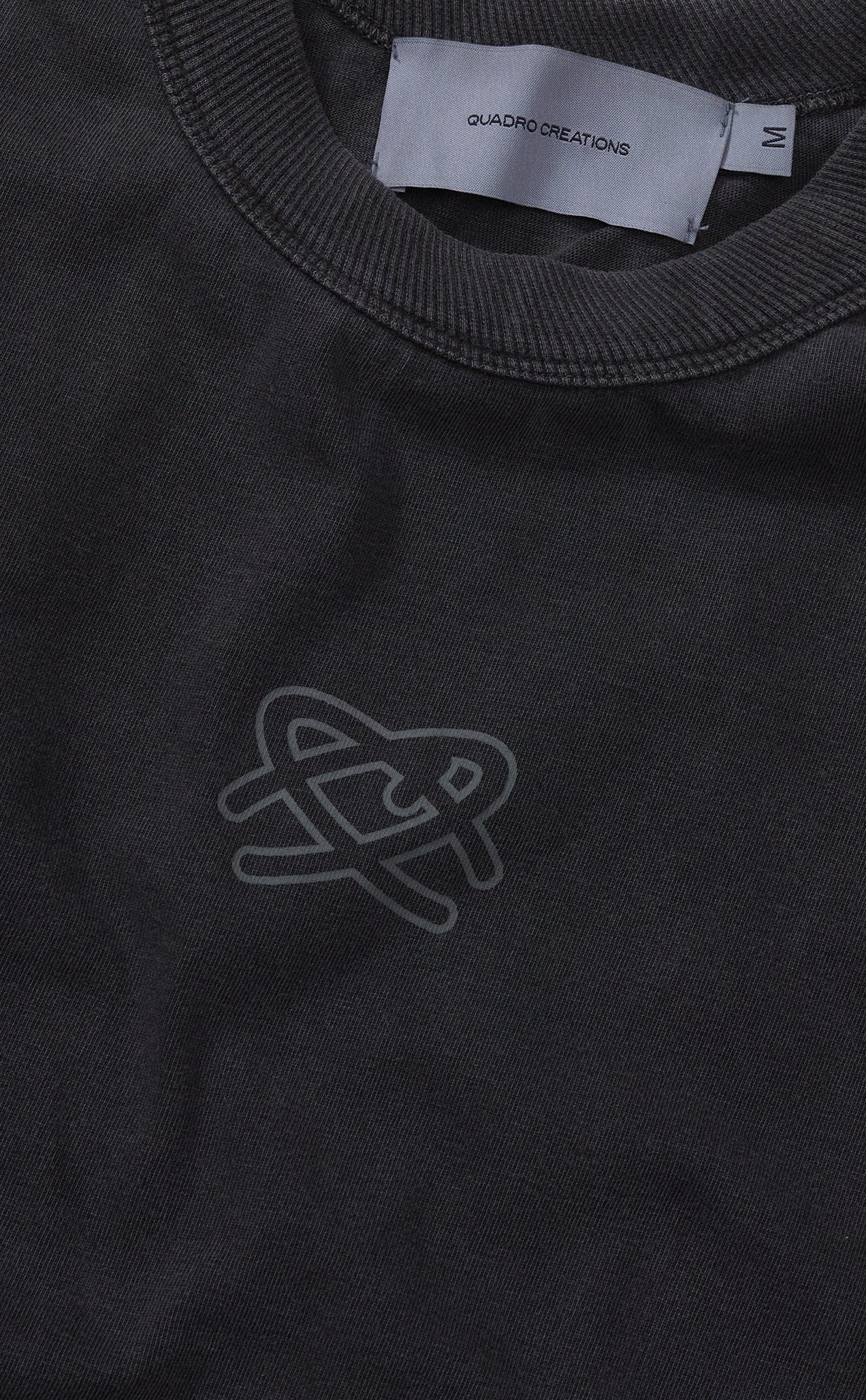CAMISETA QC SIMBOLO BOXY STONED PRETO