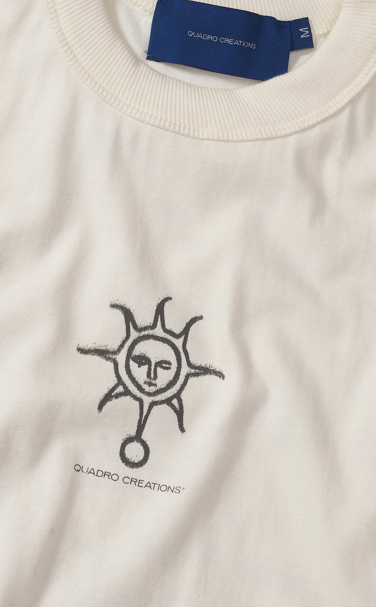 CAMISETA QC SOL EM S.A. BOXY OFF WHITE