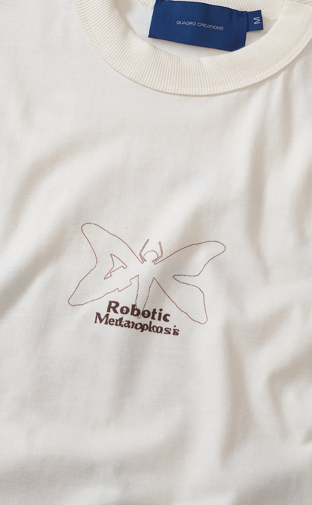 CAMISETA QC METAMORFOSE BOXY OFF WHITE